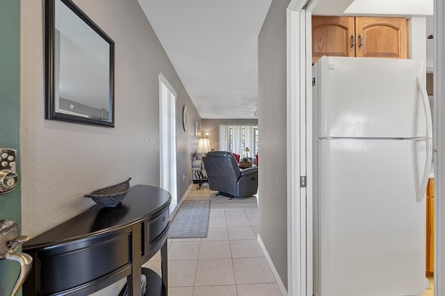 208 Lewis Cir Unit 4A, Punta Gorda, FL 33950 - hallway with light tile patterned floors and baseboards