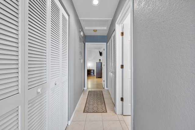 hallway featuring light tile patterned floors