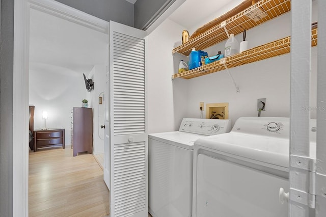 208 Lewis Cir Unit 4A, Punta Gorda, FL 33950 - laundry room featuring washer and clothes dryer and light wood-style floors