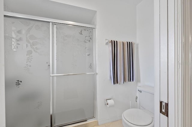 bathroom with toilet and an enclosed shower