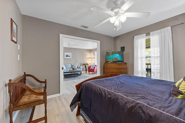 bedroom featuring ceiling fan and light wood-type flooring