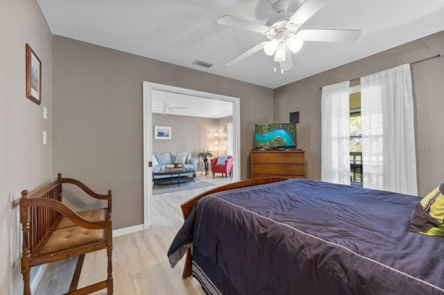208 Lewis Cir Unit 4A, Punta Gorda, FL 33950 - bedroom with light wood finished floors, baseboards, and ceiling fan