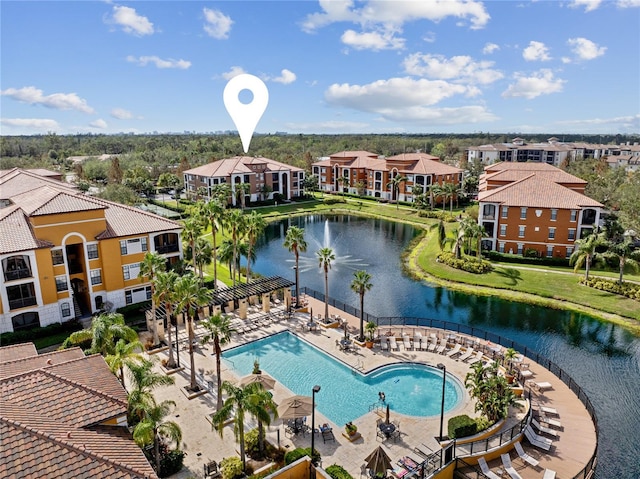 drone / aerial view featuring a water view and a residential view