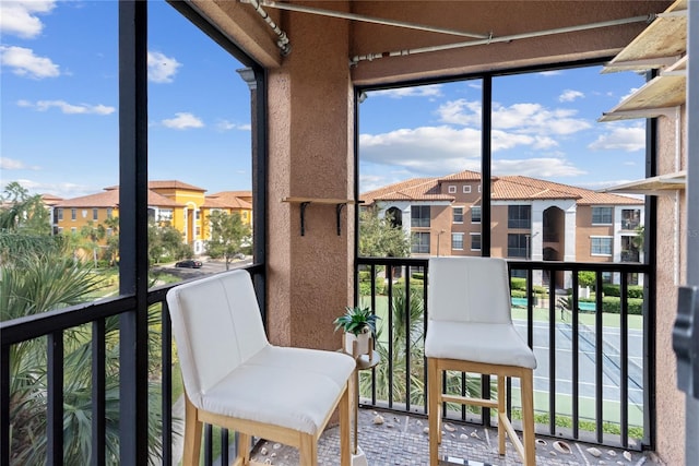 8377 38th Street Cir E Unit 308, Sarasota, FL 34243 - sunroom / solarium featuring healthy amount of natural light and a residential view