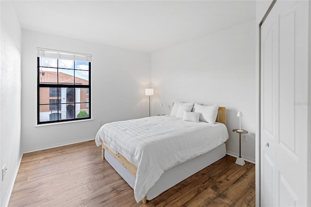 8377 38th Street Cir E Unit 308, Sarasota, FL 34243 - bedroom featuring wood finished floors and baseboards