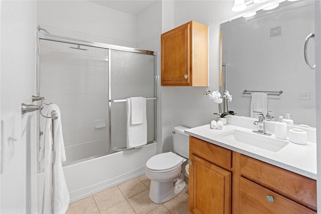 8377 38th Street Cir E Unit 308, Sarasota, FL 34243 - bathroom with vanity, tile patterned floors, toilet, and shower / bath combination with glass door