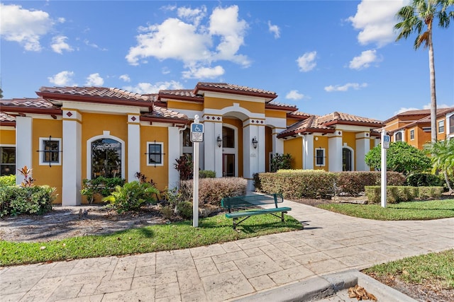 8377 38th Street Cir E Unit 308, Sarasota, FL 34243 - mediterranean / spanish-style home with a tiled roof and stucco siding