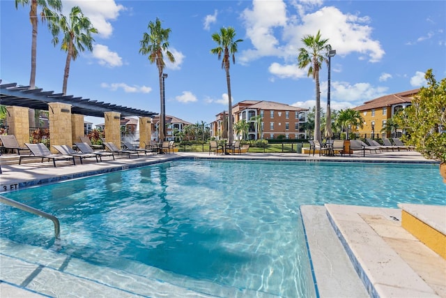 8377 38th Street Cir E Unit 308, Sarasota, FL 34243 - community pool featuring a pergola, a residential view, and a patio area