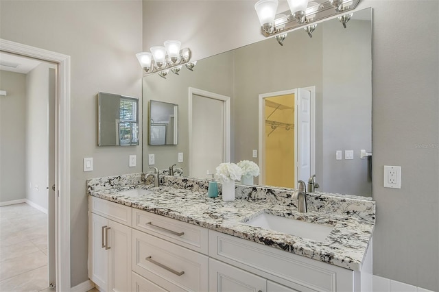 bathroom with tile patterned flooring and vanity