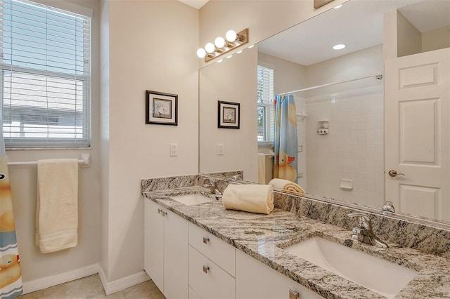 bathroom featuring tile patterned flooring, vanity, and a shower with shower curtain