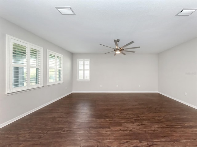 unfurnished room with dark hardwood / wood-style floors and ceiling fan