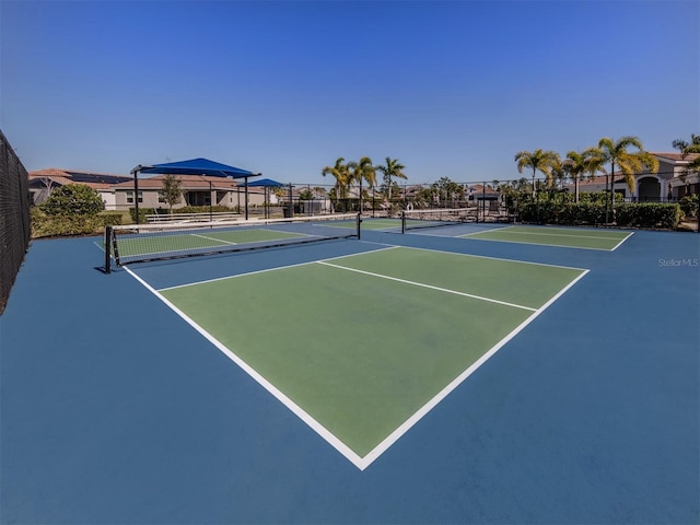 view of tennis court featuring basketball court