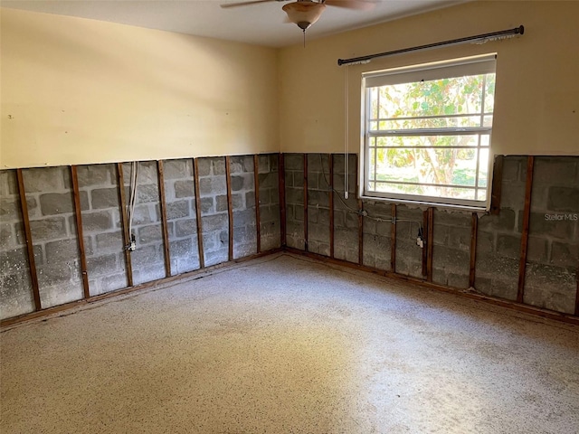 unfurnished room featuring ceiling fan