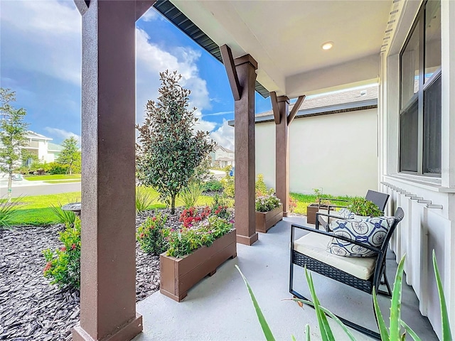 view of patio featuring a porch