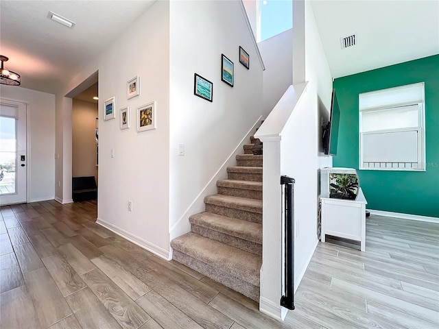 staircase featuring hardwood / wood-style floors