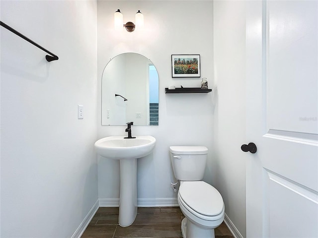 bathroom featuring sink and toilet