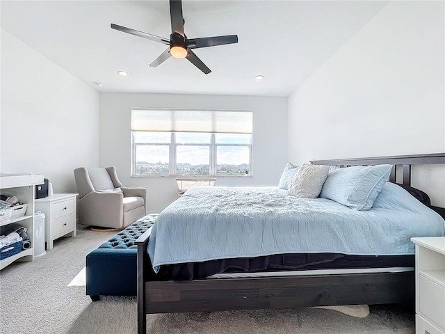 bedroom featuring ceiling fan and light carpet