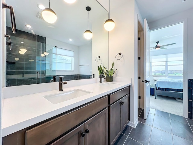 bathroom with an enclosed shower, tile patterned floors, and vanity