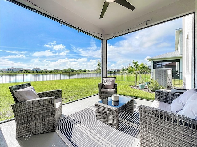 view of patio / terrace with ceiling fan, a water view, and outdoor lounge area