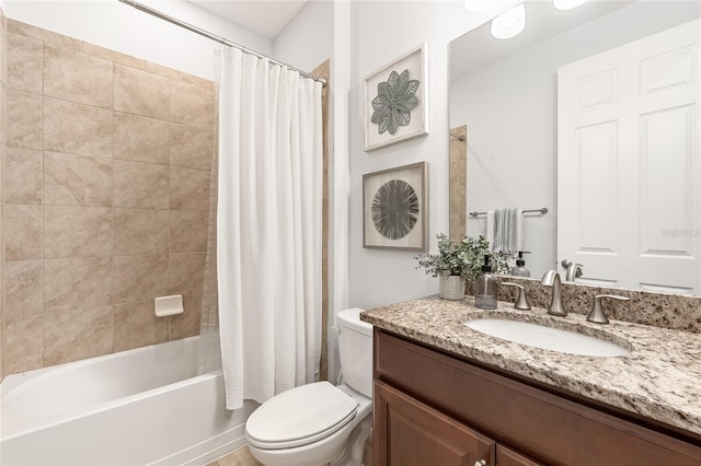 full bathroom featuring shower / bath combo, vanity, and toilet