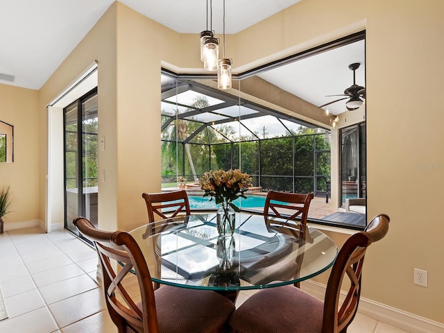 sunroom featuring a wealth of natural light, ceiling fan, and a pool