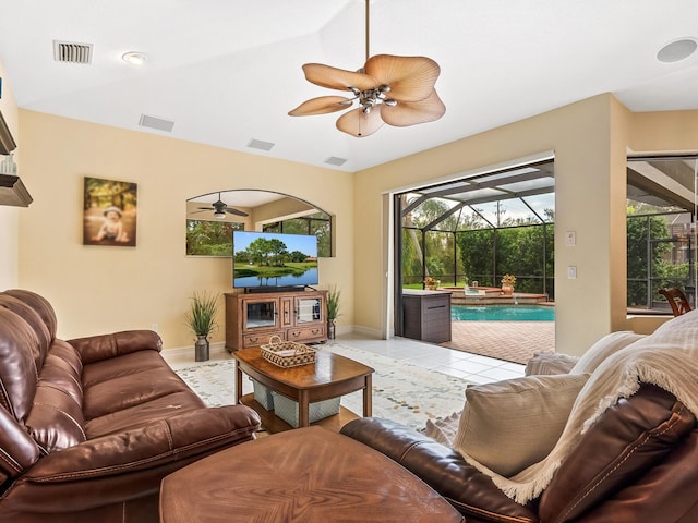 tiled living room with lofted ceiling