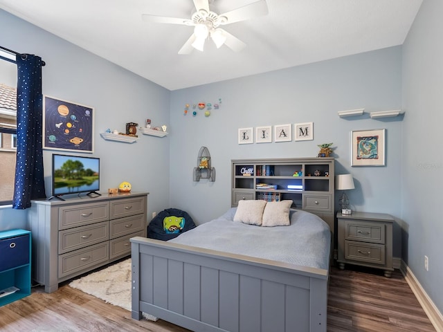 bedroom with hardwood / wood-style flooring and ceiling fan