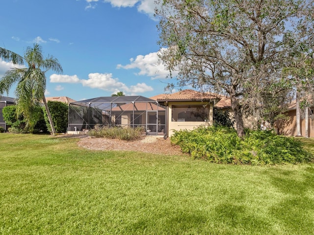 view of yard with a lanai