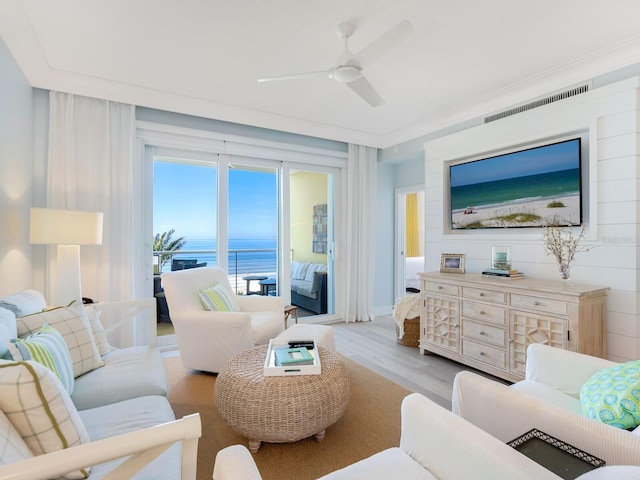 living room featuring ceiling fan and light hardwood / wood-style flooring