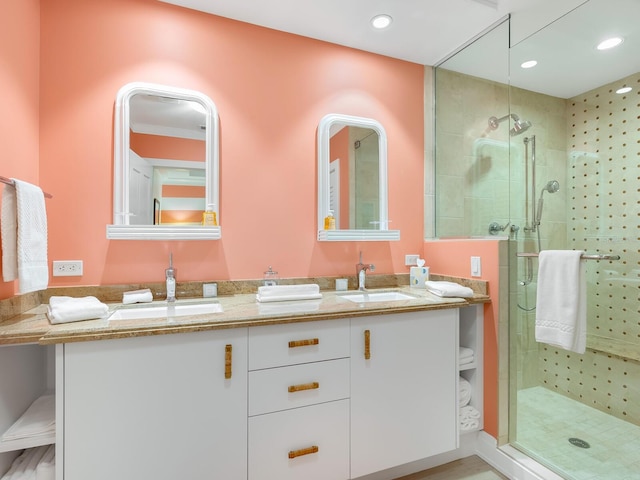 bathroom featuring an enclosed shower and vanity