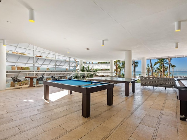 playroom featuring a wall of windows and pool table