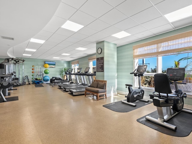 workout area with a paneled ceiling