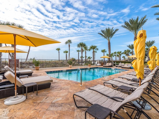 view of swimming pool with a patio