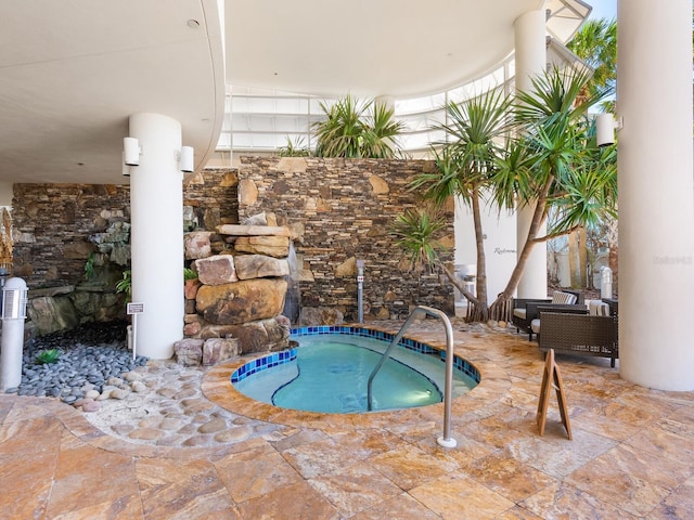 view of pool featuring an indoor in ground hot tub