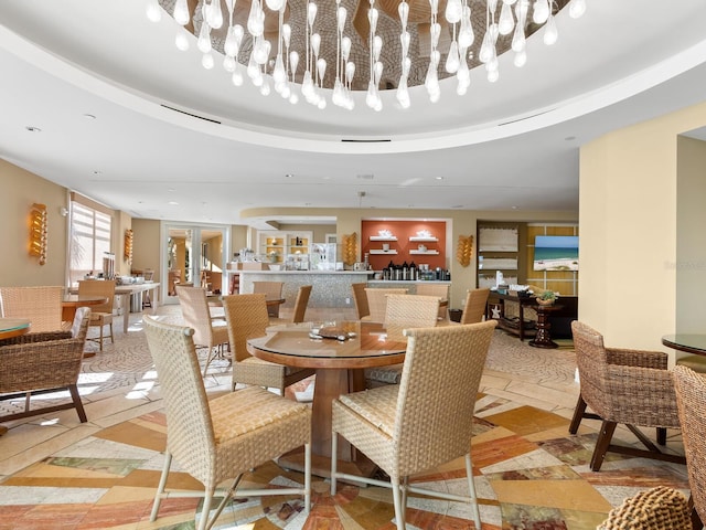 dining space featuring a raised ceiling