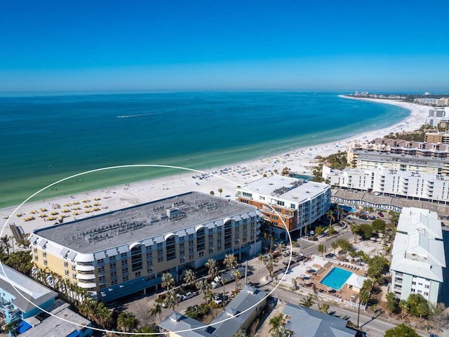 birds eye view of property with a beach view and a water view