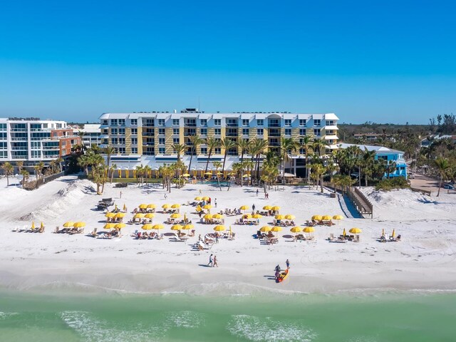 exterior space featuring a beach view and a water view