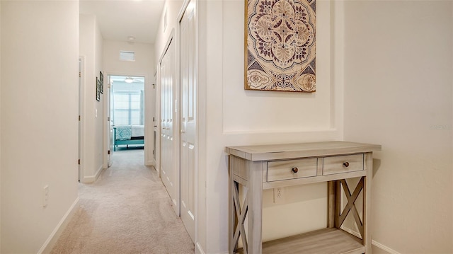 corridor with light colored carpet