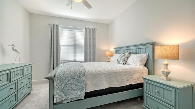 bedroom featuring ceiling fan, light colored carpet, and vaulted ceiling