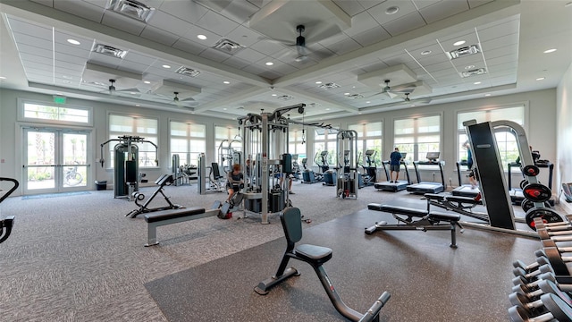 gym with french doors, a drop ceiling, and ceiling fan