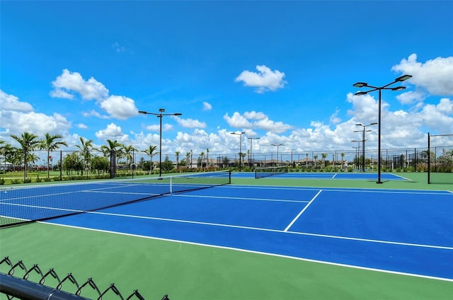 view of sport court featuring basketball hoop