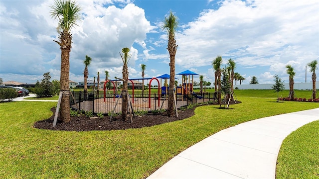 view of playground with a lawn