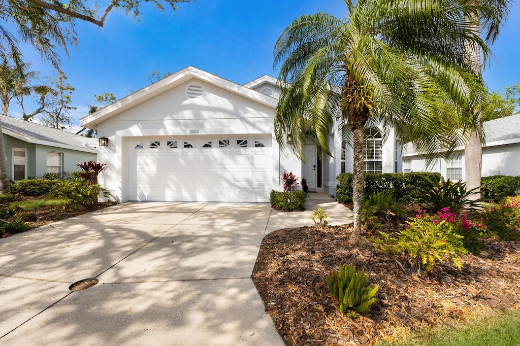 ranch-style home featuring a garage