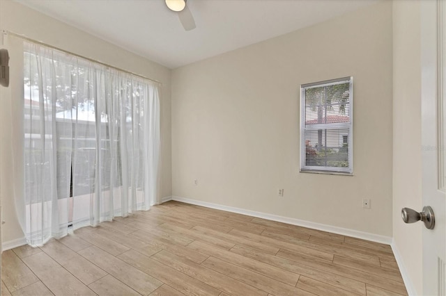 unfurnished room featuring ceiling fan and light hardwood / wood-style flooring