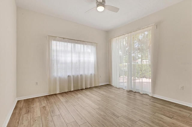 unfurnished room featuring ceiling fan and light hardwood / wood-style flooring