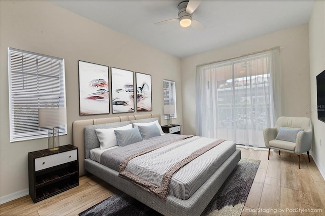 bedroom featuring ceiling fan and light hardwood / wood-style flooring