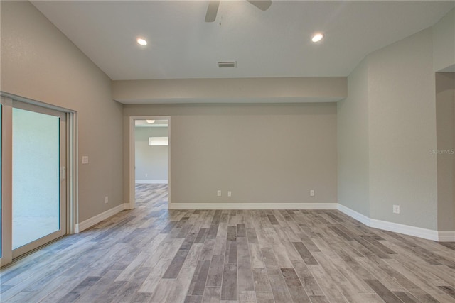 spare room with light hardwood / wood-style floors and ceiling fan