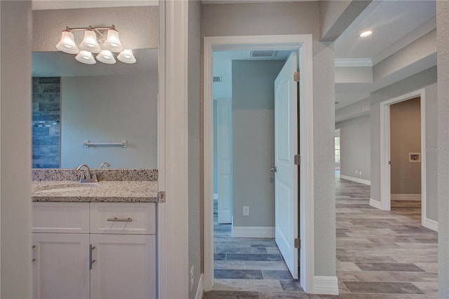 bathroom with vanity and hardwood / wood-style flooring