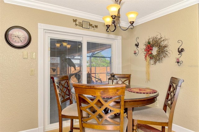 dining space featuring crown molding and a notable chandelier