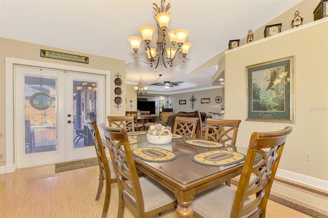 dining space featuring ceiling fan, french doors, and light hardwood / wood-style flooring